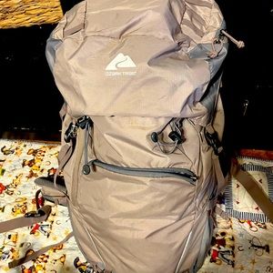 Ozark trail, 50L beige and gray hiking backpack.